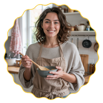 Aliana Recipes – Smiling woman in cozy kitchen holding a bowl and spoon