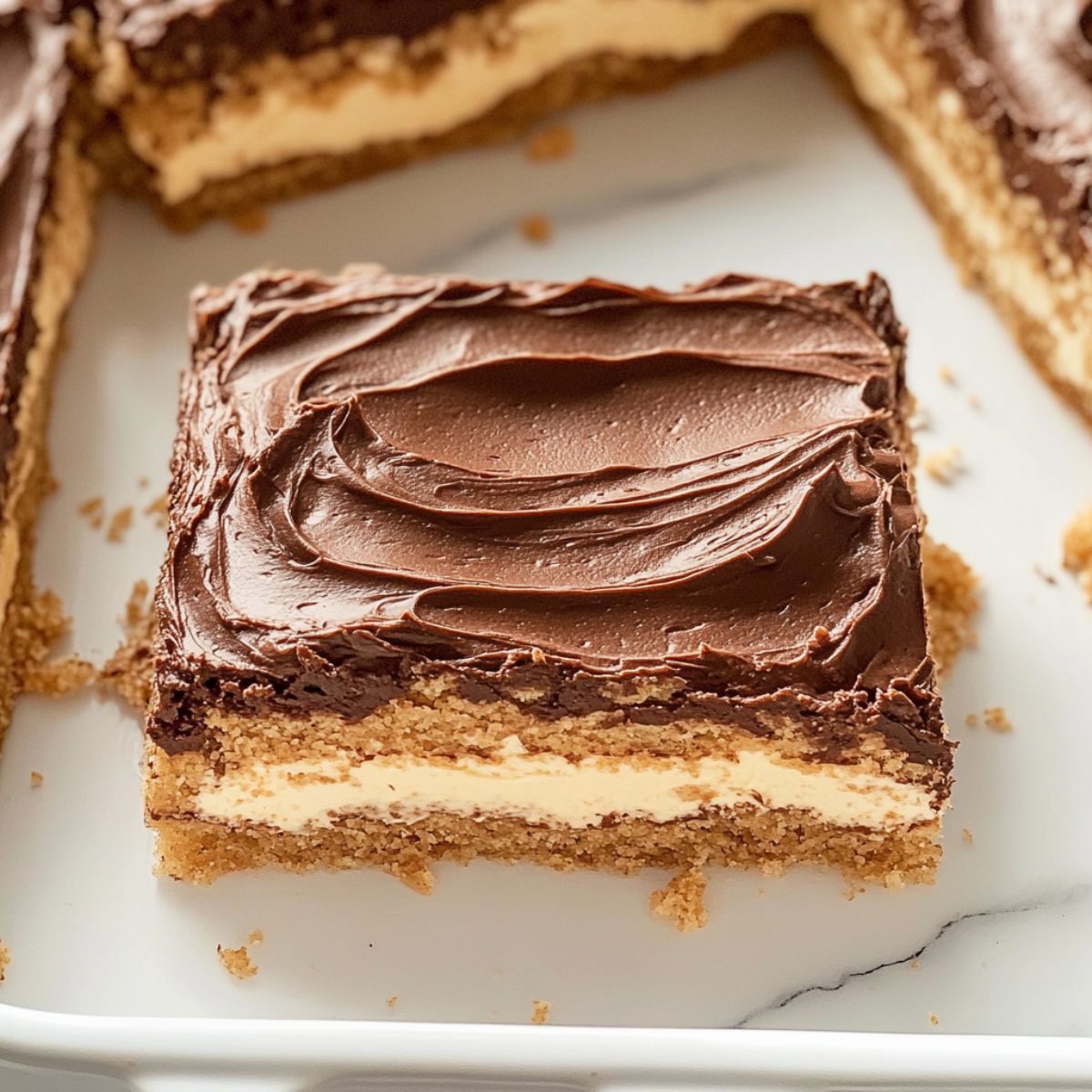 Close-up of a single slice of chocolate eclair cake with visible layers.
