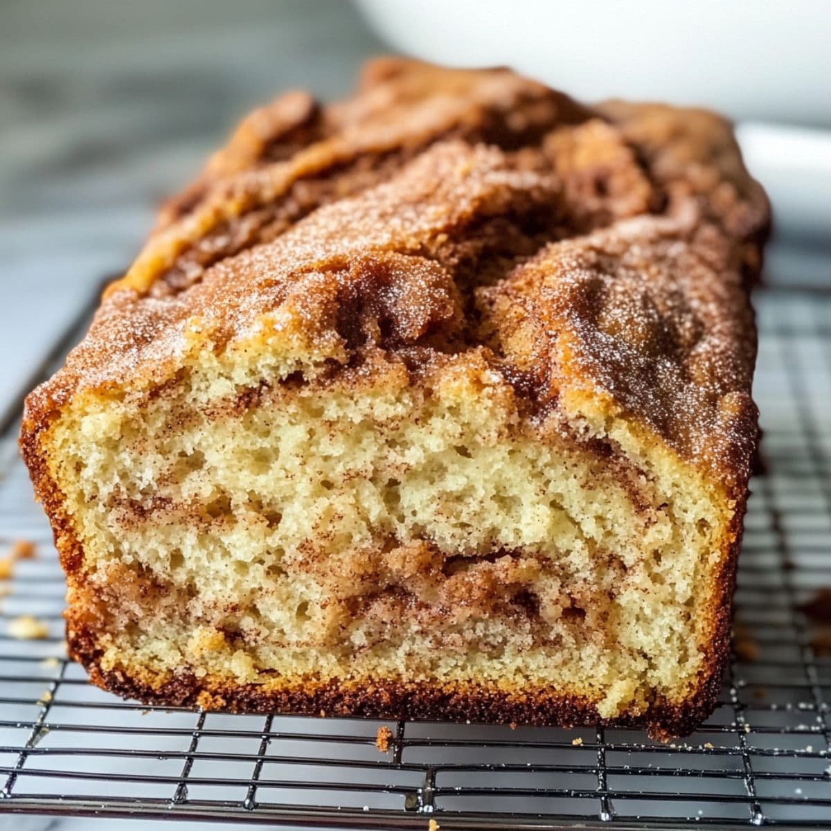 Amish cinnamon bread loaf cooling on rack, ready for storage