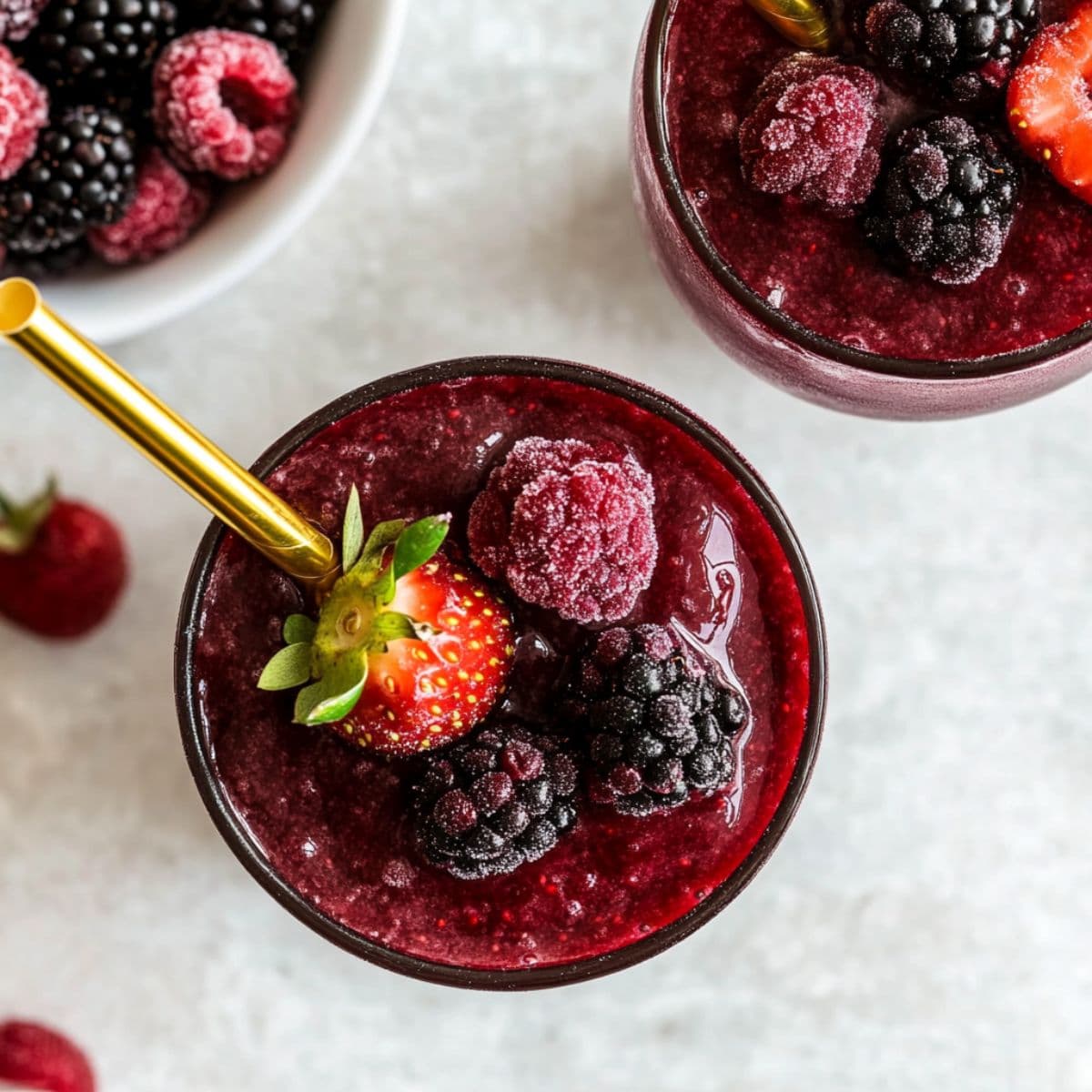 Red wine berry slushies with frozen fruit and side berries