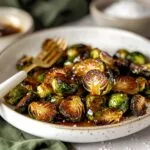 Ultimate Longhorn Brussels sprouts copycat recipe with perfect golden caramelized edges and glossy honey butter sauce in elegant white serving dish