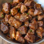 Garlic butter steak bites perfectly seared with golden brown crust and fresh parsley garnish
