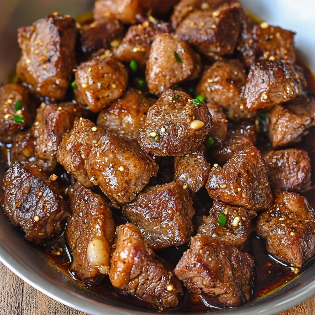 Garlic butter steak bites perfectly seared with golden brown crust and fresh parsley garnish