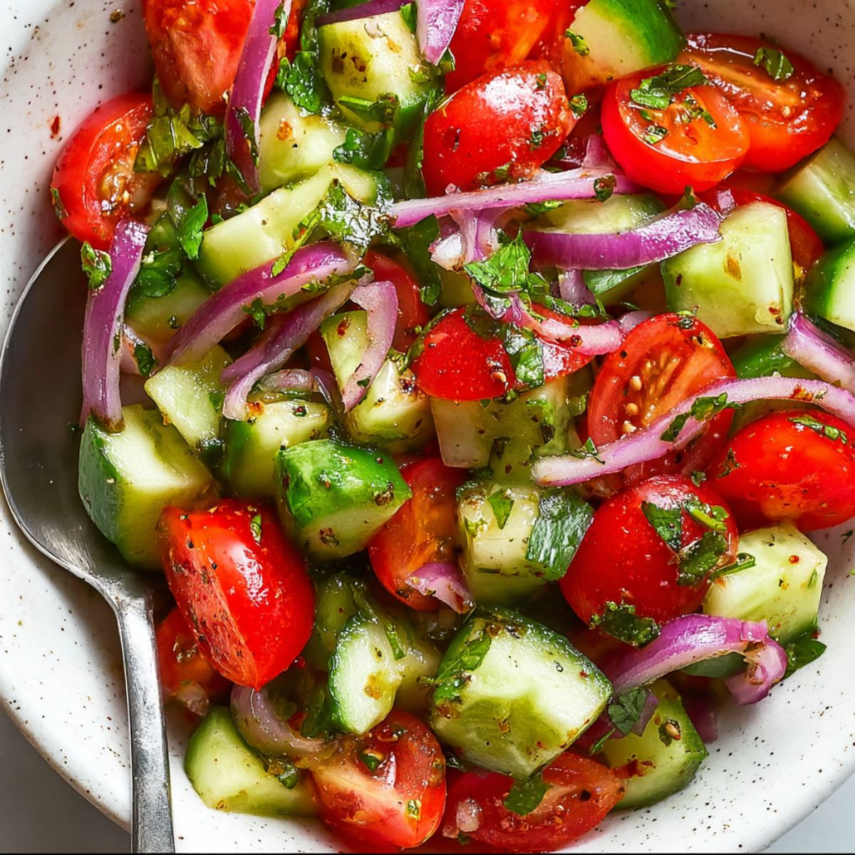 This cucumber and tomato salad recipe creates the most refreshing summer side dish with crisp vegetables, red onion, and tangy dressing. Ready in just 10 minutes using fresh farmers market produce for maximum flavor and crunch.
