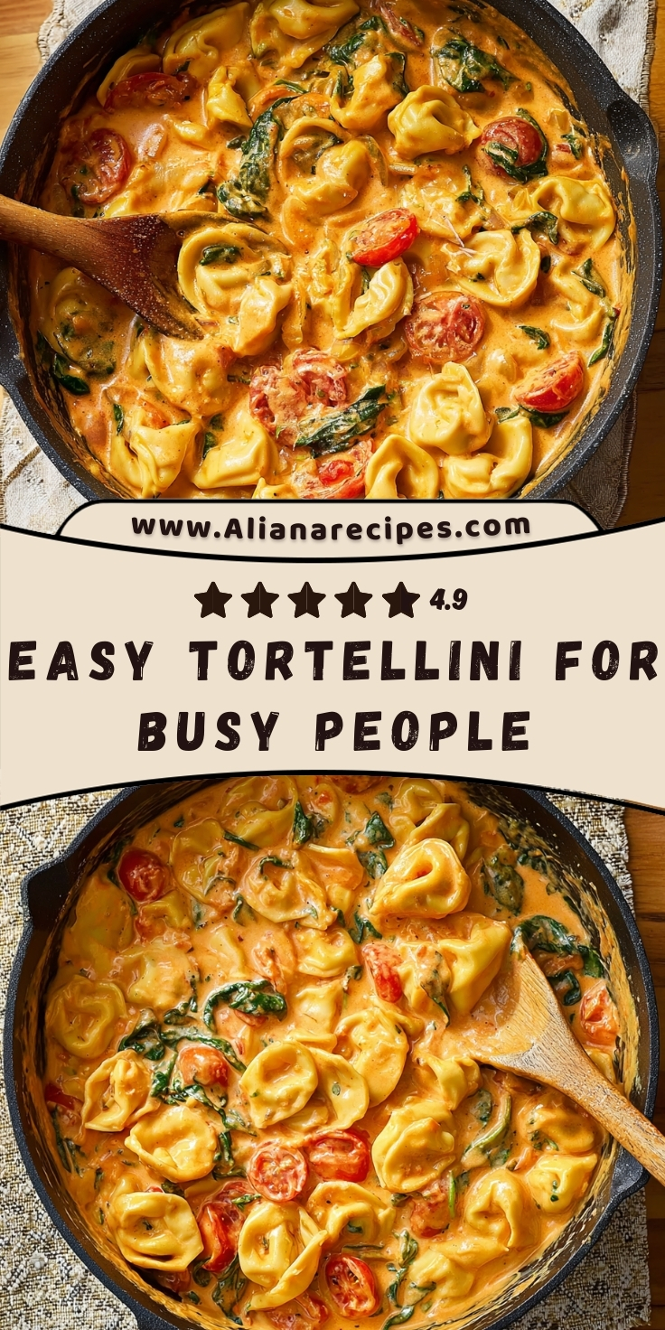 Tortellini in creamy garlic sauce with cherry tomatoes and spinach in cast iron skillet with wooden spoon and recipe rating overlay