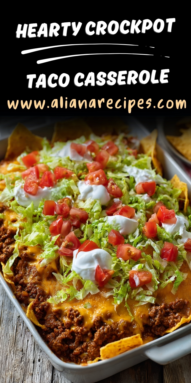 Crockpot taco casserole hearty dinner with ground beef, cheese, tortilla chips, fresh lettuce, diced tomatoes, and sour cream in white baking dish