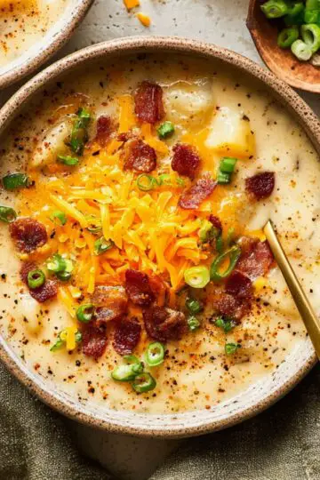 Crock Pot Crack Potato Soup 3 A warm bowl of Crock Pot Crack Potato Soup topped with crispy bacon.
